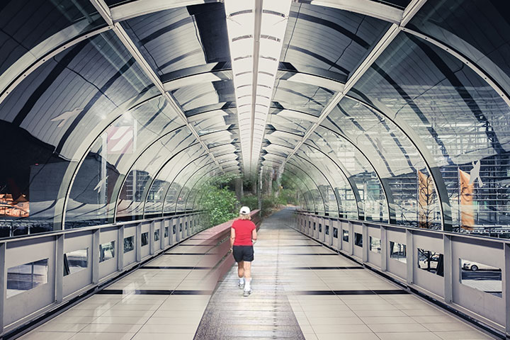 Woman walking through a long dome