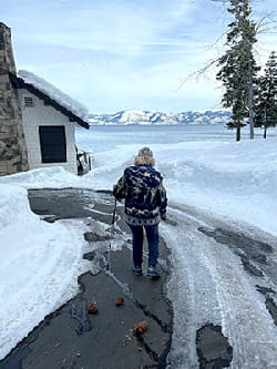 A woman standing in a snowy icy landscape
