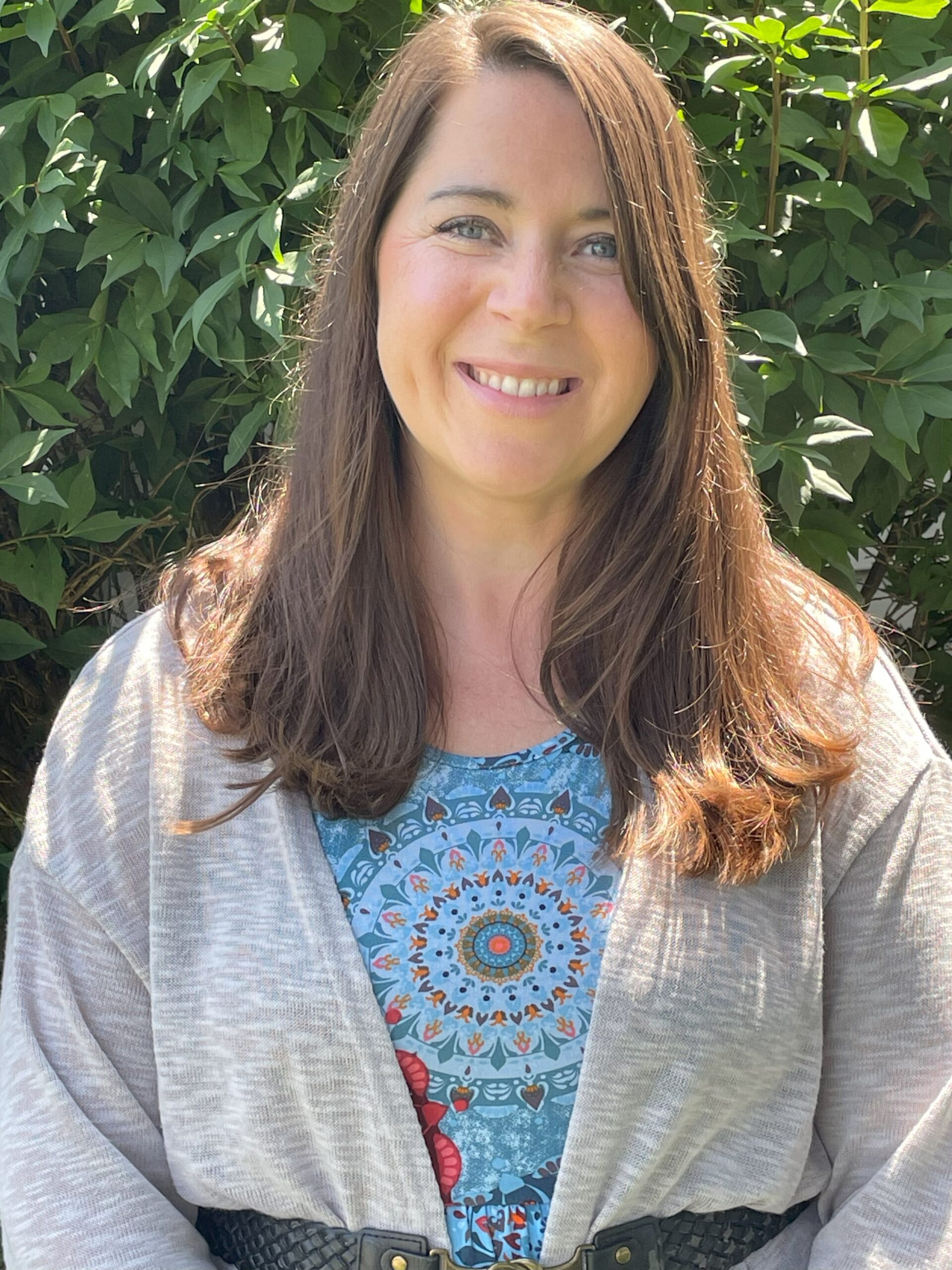 A woman with brown hair and blue eyes who is a stroke survivor